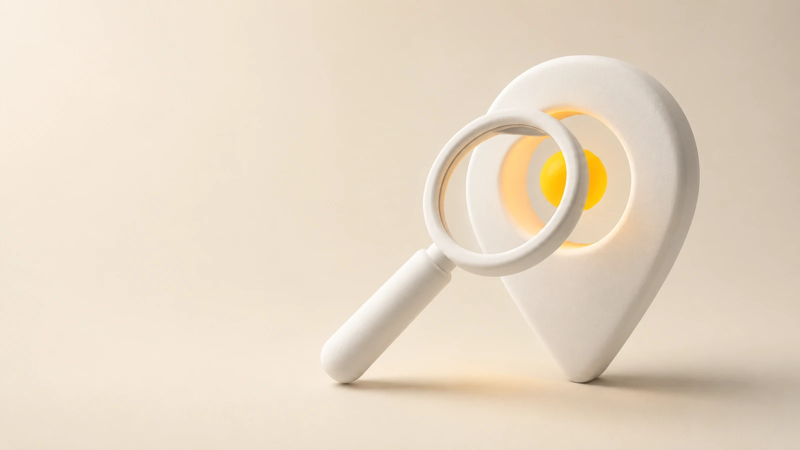 Magnifying glass over a white location pin with a yellow circle inside.