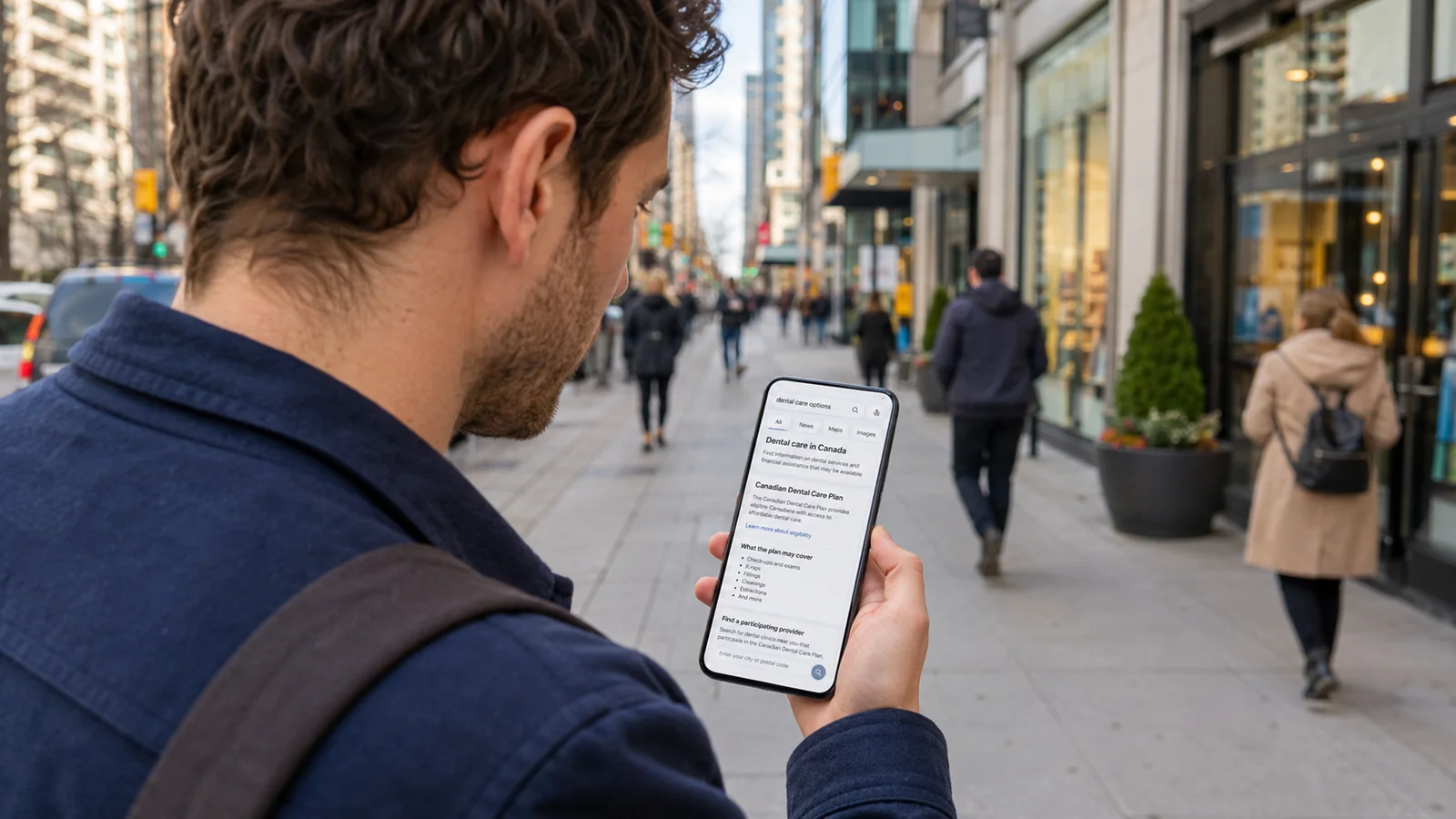 Person checking CDCP dental clinic search results on a smartphone while walking through a GTA city street, illustrating mobile-first local search behaviour