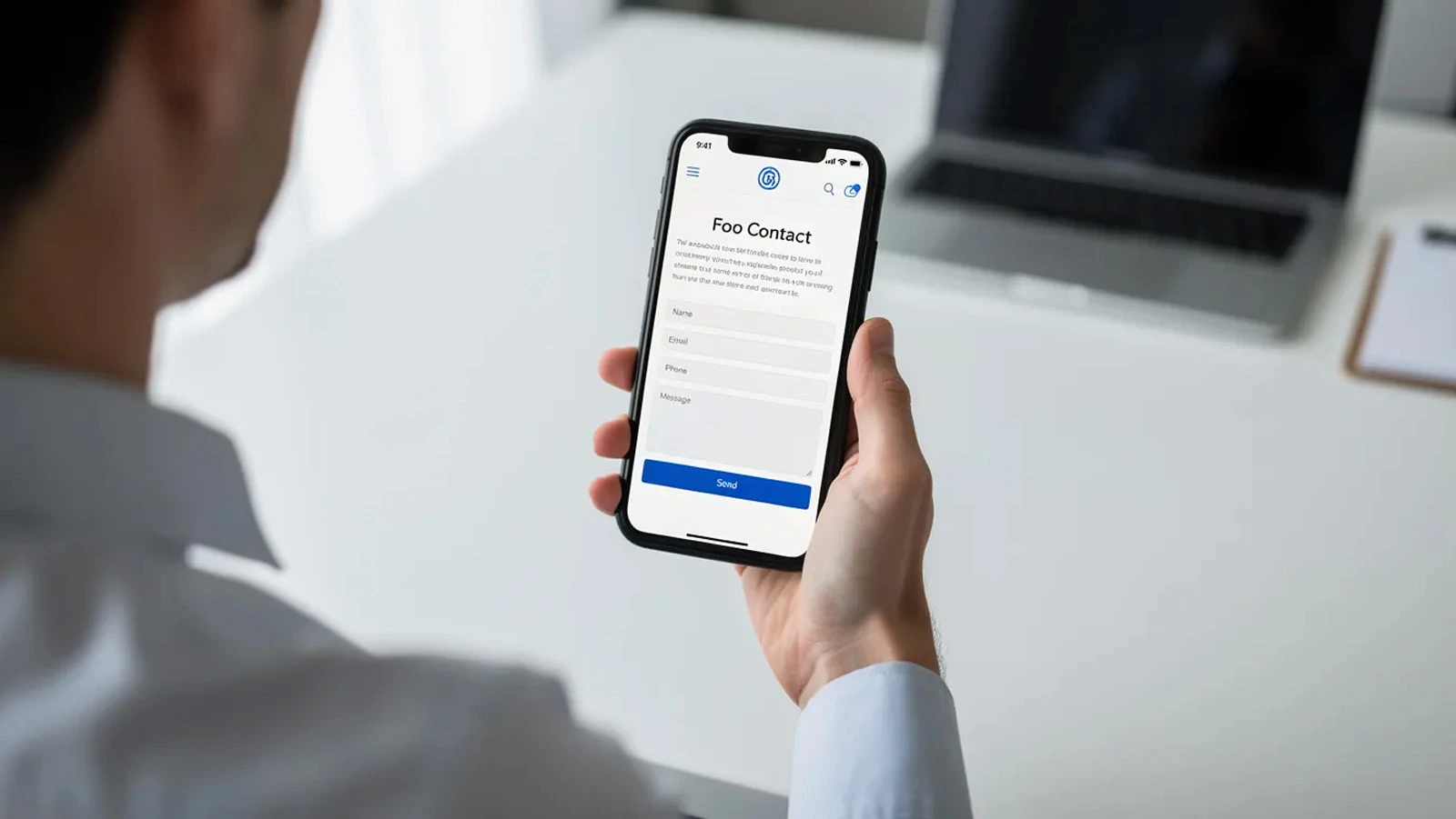 Person using a smartphone to browse a professional service website with a contact form displayed, illustrating how landing pages and conversion tracking capture leads from Google Ads campaigns